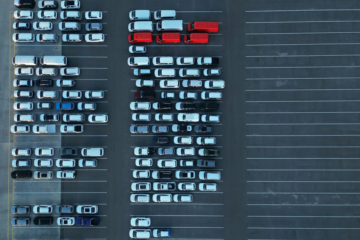 Company fleet vehicles arranged in a parking area